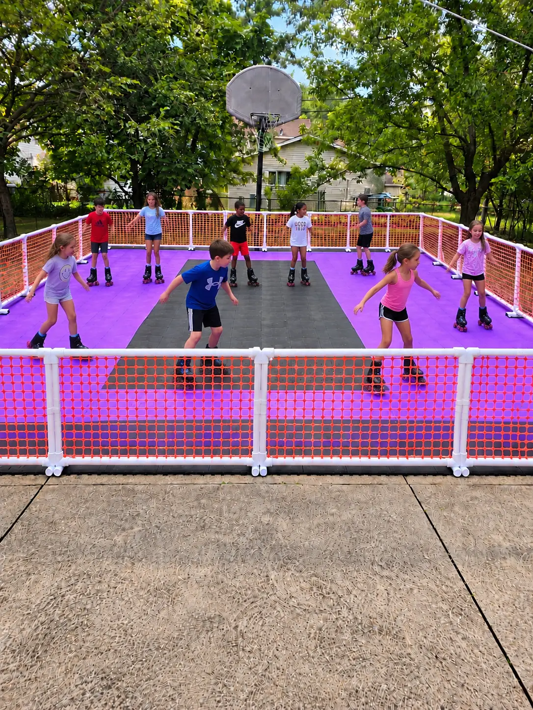 Children skating on the Roller Zone mobile rink at a backyard party